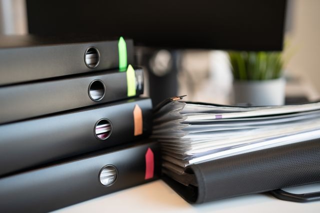 a stack of binders in an office