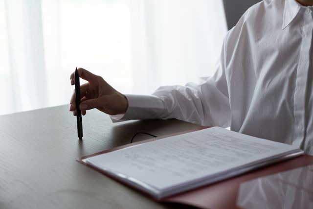 person filling out a document